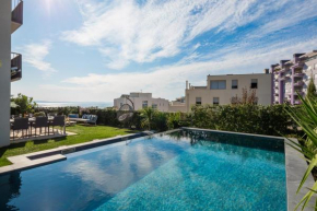 New luxury apartment with PRIVATE Heated POOL and amazing garden with seaview